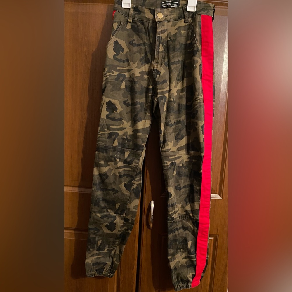 Camo Pants w red stripe on each sides. elastic at ankles to make more fitted.